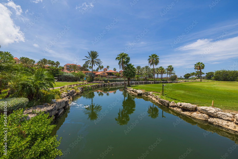 Beautiful view of lake on the golf courses on sunny day. Aruba.