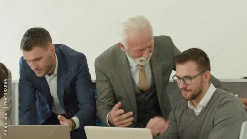Group of businessmen and businesswomen working together in office Group of businessmen and businesswomen working together in office