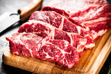 Beef raw cut on a cutting board. 