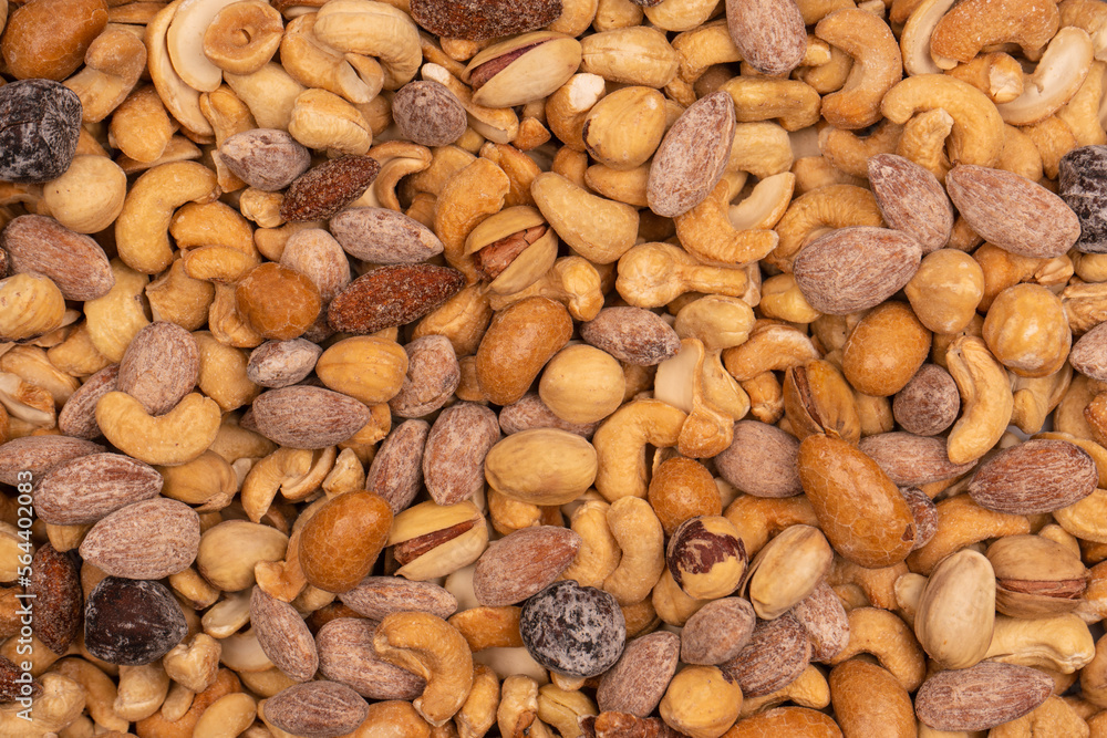 A group of almonds, pistachios, walnuts, macadamia, cashews. A group of almonds, pistachios, walnuts, macadamia, cashews.