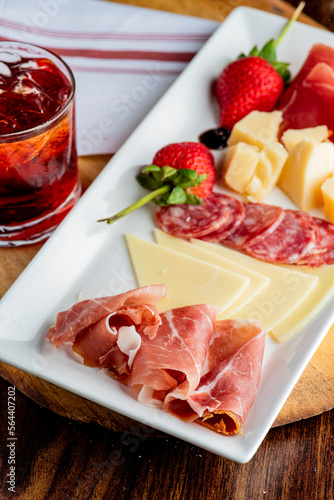 Charcuterie Board. Cheese Board Assortment on cured and salted deli meats and cheeses, pastrami, salami, prosciutto served with olives and dried fruits. Classic traditional party favorite. 