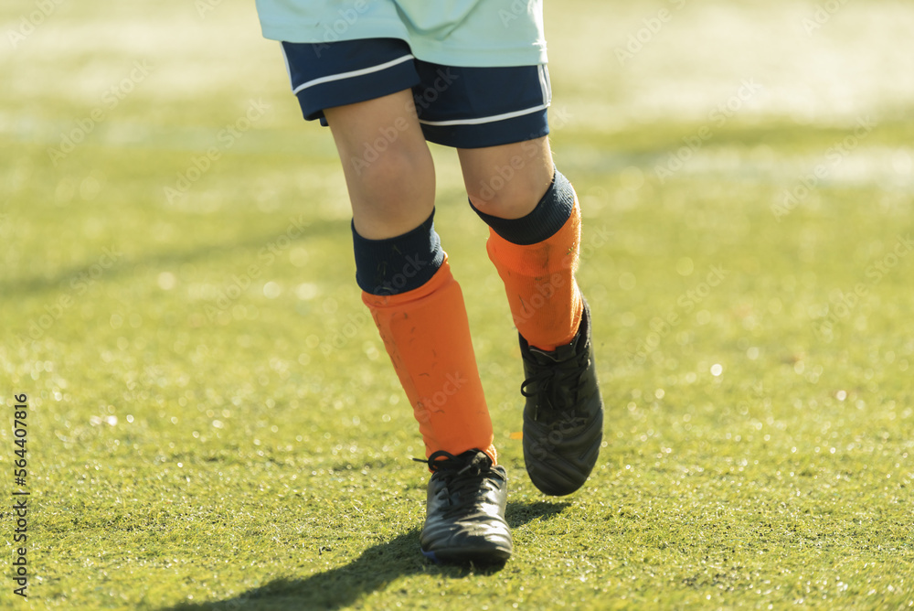 leg children run play soccer orange footwear grass stadium leg children run play soccer orange footwear grass stadium