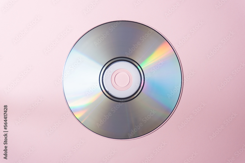 CD record on a pink background. Photo for banner on your website about music CD record on a pink background. Photo for banner on your website about music