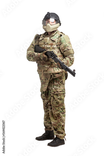 soldier in military equipment with a shotgun on a white background, commando in uniform with a weapon