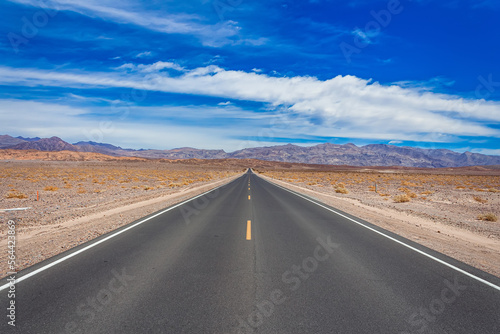 Endless straight highway crossing the Mojave desert © Christian