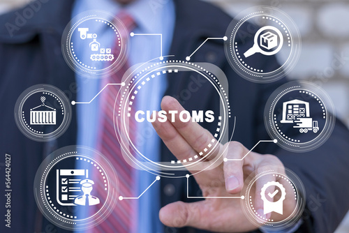 Businessman using virtual touchscreen presses the abbreviation: CUSTOMS. Concept of customs. Customs declaration clearance. Customs registration. Cargo delivery, import and export.