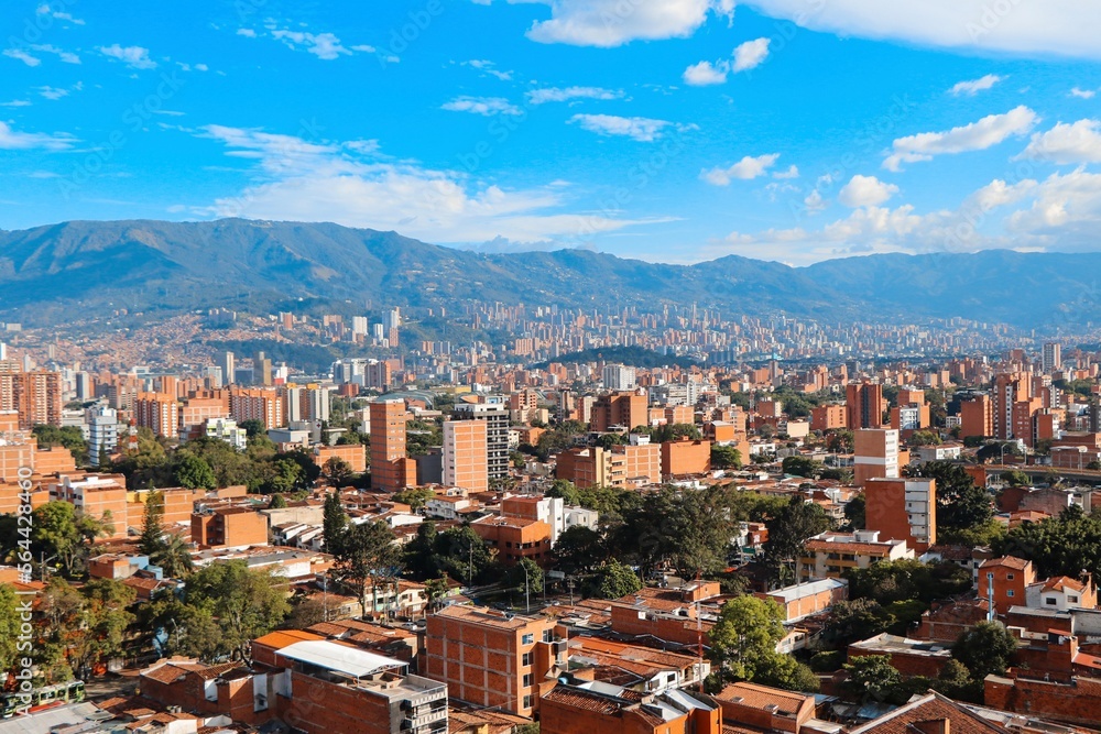 Panoramic view to Medellin, Laureles and El Poblado districts,  Colombia, sunny day with clear blue sky
