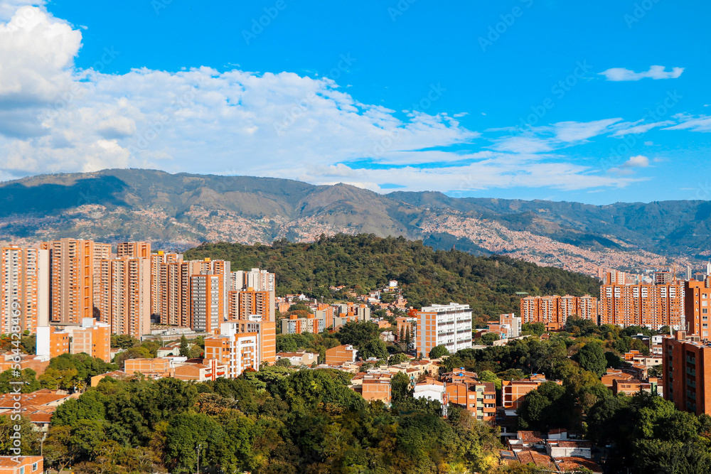 Panoramic view to Medellin, Laureles and El Poblado districts,  Colombia, sunny day with clear blue sky