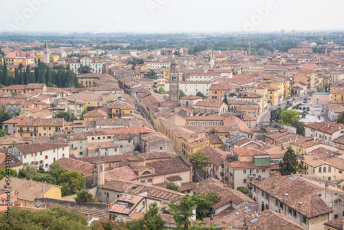 Beautiful view of the panorama of Verona and the Lamberti tower on the banks of the Adige River in Verona, Italy