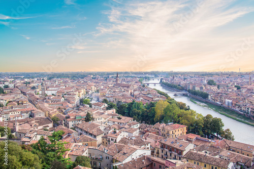 Beautiful view of the panorama of Verona and the Lamberti tower on the banks of the Adige River in Verona, Italy