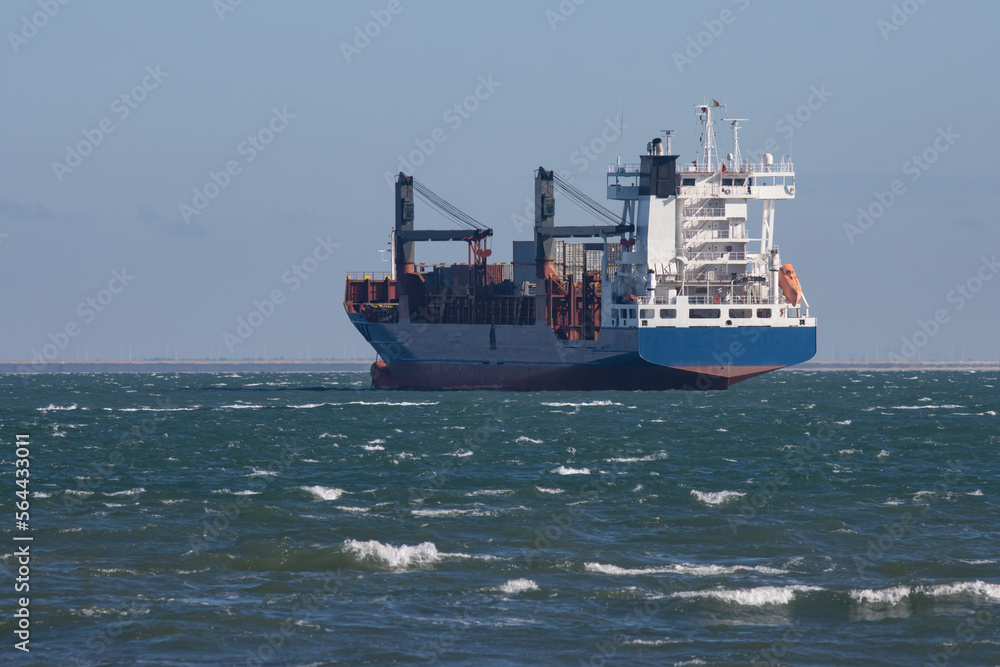 A big cargo ship sails the sea