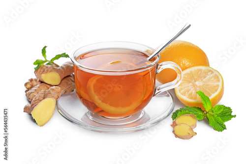 Glass cup with delicious ginger tea, lemon and mint on white background