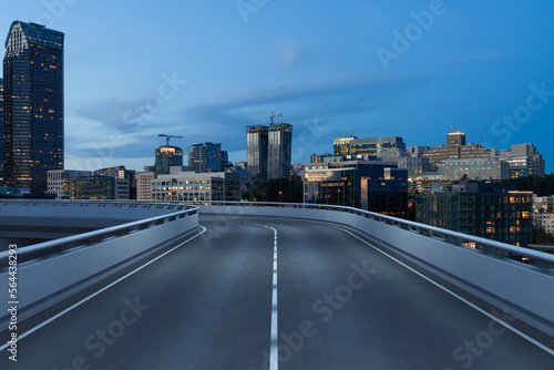 Empty urban asphalt road exterior with city buildings background. New modern highway concrete construction. Concept way to success. Transportation logistic industry fast delivery. Seattle. USA.