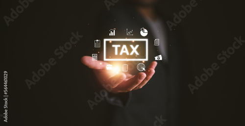 Businesman show TAX for Individual income tax return form online for tax payment concept. Government, state taxes. Data analysis, paperwork, financial research, report. Calculation tax return.