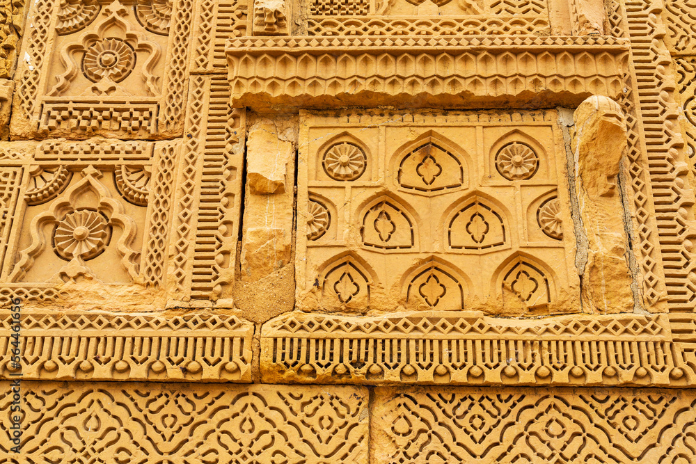 Thatta, Sindh, Pakistan - October 2021: Beautiful traditional intricate geometric and floral carved stone detail, decoration, in a royal mausoleum in Makli necropolis