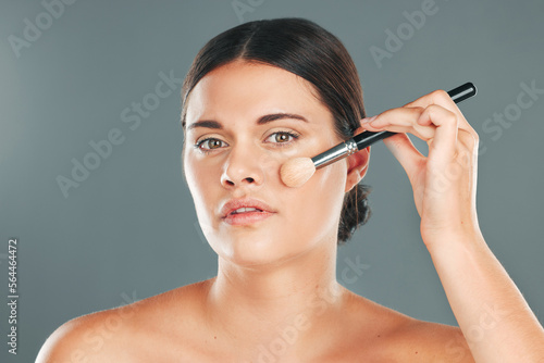 Woman, beauty brush and makeup portrait for wellness, cosmetics dermatology and skincare in studio. Model, facial application and cosmetology lifestyle or luxury product tools for self care glow
