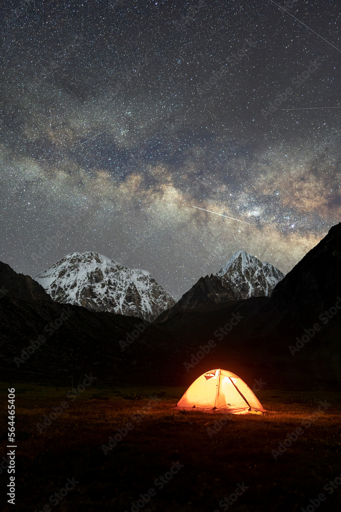 Camping under snow mountain and galaxy