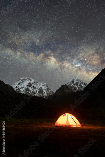 Camping under snow mountain and galaxy