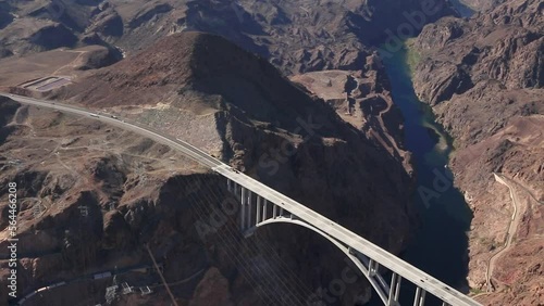 Aerial of the Bridge by the Hoover The Hoover Dam, a Major tourist attraction in the USA. The dam on the Colorado river impounds Lake Mead, Four-lane Hoover Dam Bypass it includes steel and concrete.