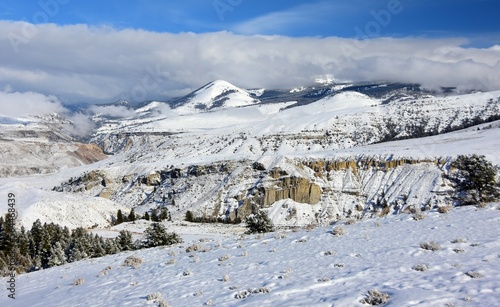 beautiful view of the  absaroka mountain range and gardner canyon on a sunny winter day along the  old gardiner road in yellowstone national park, south of  gardiner, montana photo