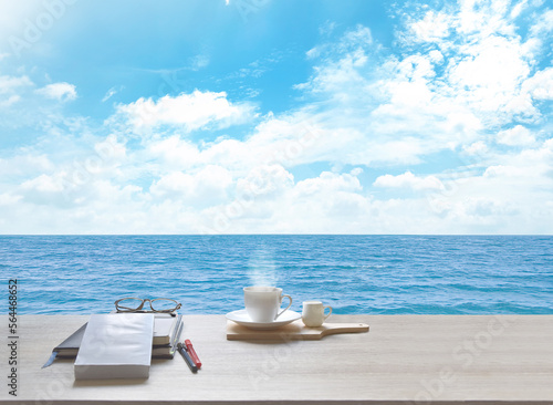 Sea, sky and white clouds. Nature, with coffee cup, tablet, glasses, diary, book, pen And Writing notebook to record the memories of the holidays., in Thailand. With copy space.