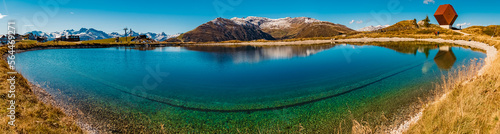 High resolution panorama with the famous Capella Granata and reflections in a lake at the Penken summit, Mayrhofen, Tyrol, Austria