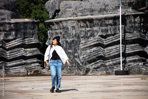 Thai people women travelers travel visit and posing portrait at Prasat Hin Phanom Rung Stone Castle Sanctuary building Khmer Hindu Temple in Historical Park at Prakhon Chai city in Buri Ram, Thailand