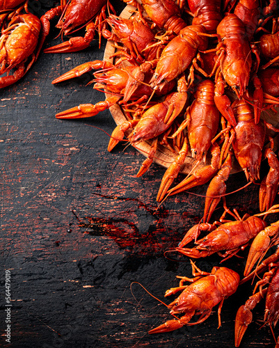 Boiled crayfish on a cutting board.  © Artem Shadrin