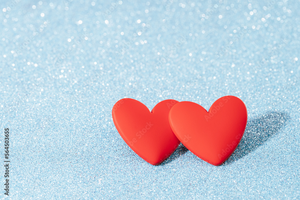 Two Red hearts, love greeting card. Bokeh blue abstract sparkling background. Valentines Day card or winter wedding Two Red hearts, love greeting card. Bokeh blue abstract sparkling background. Valentines Day card or winter wedding