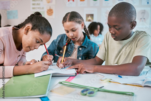 Teamwork, education, and group of children in classroom working together on project in Montessori school. Books, help and diversity, young students writing or drawing in notebook for fun art homework