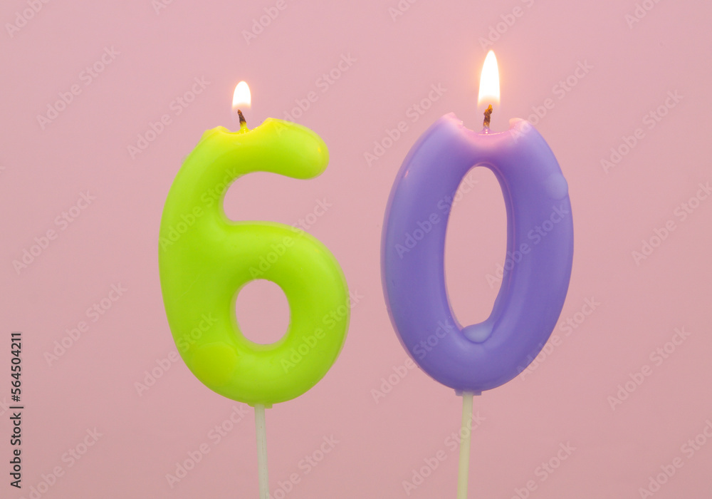 Birthday candles on pink background, number 60