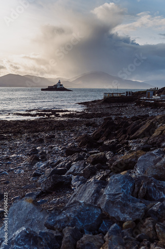 Aerial panorama view of the historic Fenit Lighthouse in Tralee Bay, beautiful clouds, sunset. High quality photo
