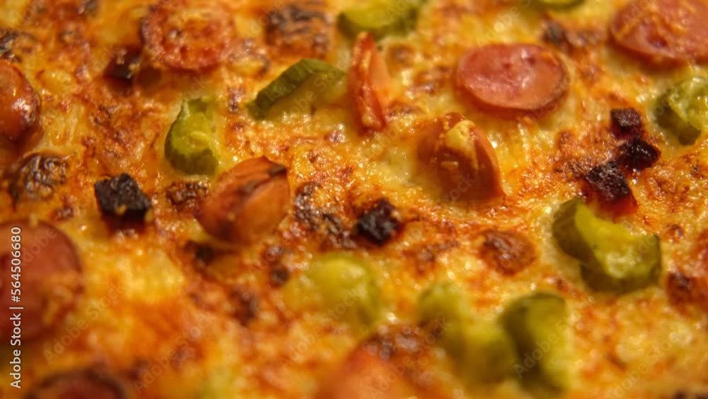 Close up of pizza. Circle hot pizza is turning. View from above. Ultra Close-Up Angle Macro Video of Delicious Steaming Hot Pizza Fresh Out Of The Oven. Copy Space. Rotating pizza surface. Fast food Close up of pizza. Circle hot pizza is turning. View from above. Ultra Close-Up Angle Macro Video of Delicious Steaming Hot Pizza Fresh Out Of The Oven. Copy Space. Rotating pizza surface. Fast food