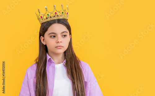 teen selfish girl with crown in studio, copy space. teen selfish girl with crown photo