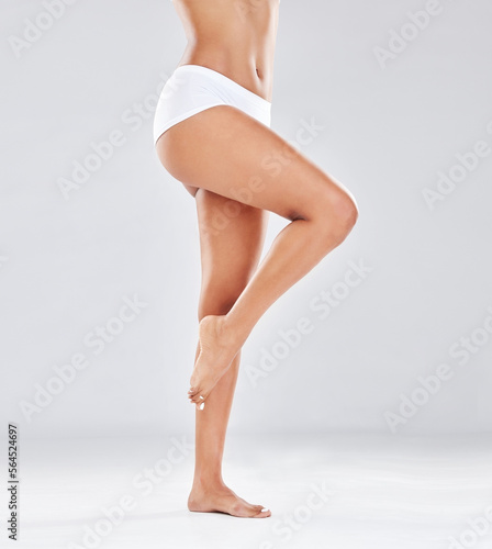 Legs, feet and skin with woman body in underwear isolated on studio background, epilation and skincare beauty. Hair removal mockup, grooming and glow with wellness, cosmetic pedicure with hygiene