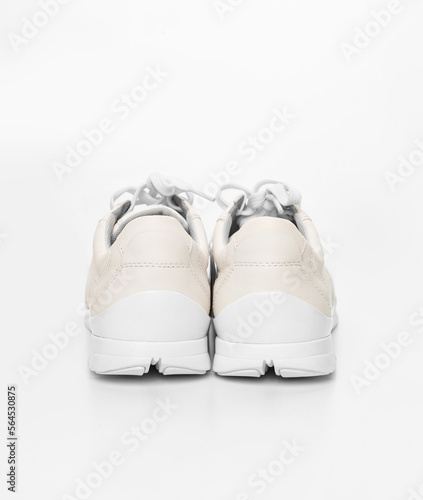 back of leather sneakers with lacing on a white background. 
