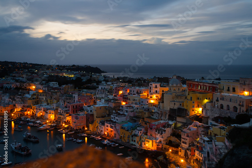 Beautiful fishing village at night, Marina Corricella on Procida Island, Bay of Naples, Italy.