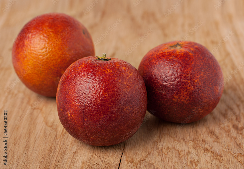 Sicilian oranges over a wooden background Sicilian oranges over a wooden background