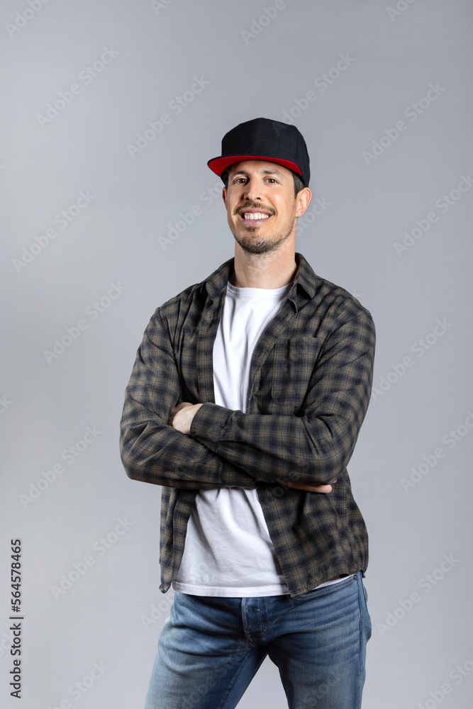 Man in casual clothes posing looking at camera isolated on gray background Man in casual clothes posing looking at camera isolated on gray background