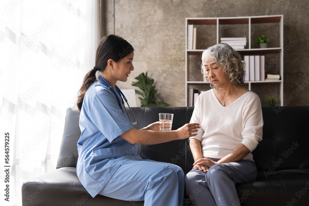 Healthcare worker or nurse caregiver giving pills, showing a prescription drug to senior woman. Elderly healthcare concept Healthcare worker or nurse caregiver giving pills, showing a prescription drug to senior woman. Elderly healthcare concept