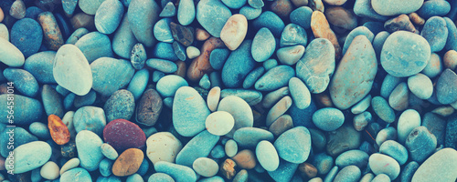 Abstract nature pebbles background. Stone background. Sea pebble beach. Beautiful nature. Turquoise color Horizontal banner