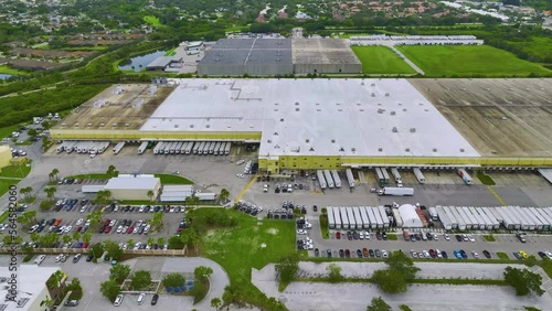 Wallpaper Mural Aerial view of large commercial distribution center with many trucks unloading and uploading retail products for further shipment Torontodigital.ca