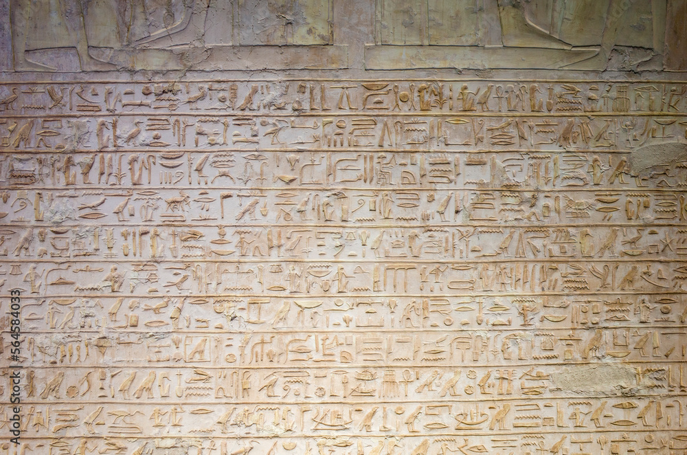 Stone wall completely inscribed with ancient Egyptian hieroglyphs, ancient civilization historical pattern