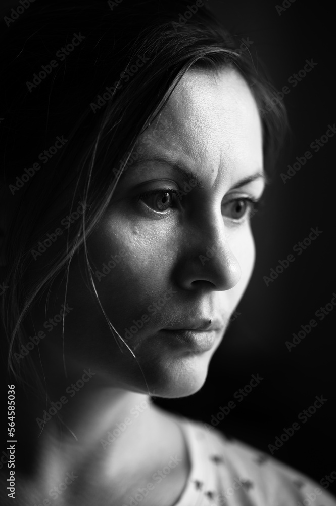 Monochrome portrait of a woman with light from the window, portrait of a young man. Monochrome portrait of a woman with light from the window, portrait of a young man.
