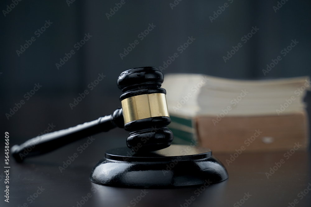 gavel and blurry book on background gavel and blurry book on background
