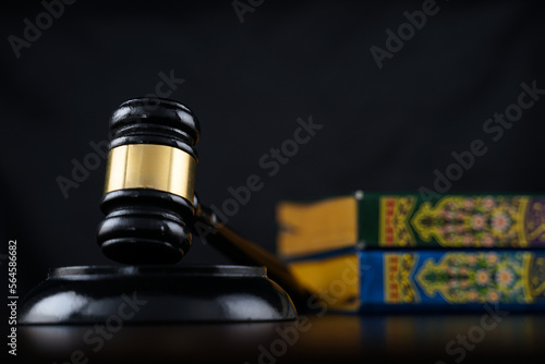 gavel and blurry book on background 