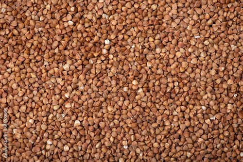Top-down background of buckwheat. Close up of buckwheat grain