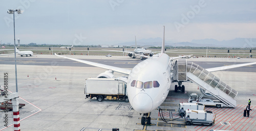 Airport runway, global travel and airplane ready for takeoff, international flight and commercial transportation. Air transport, journey and plane at terminal loading cargo, baggage and luggage