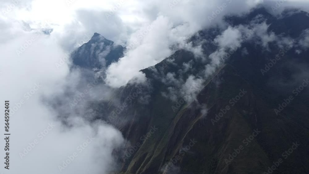 clouds over the mountains in Peru at Machu Picchu clouds over the mountains in Peru at Machu Picchu