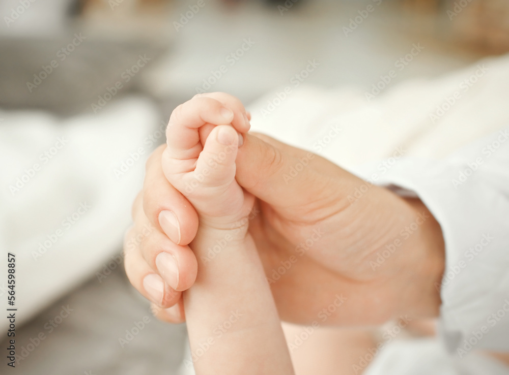 Mother with her newborn baby care hands Mother with her newborn baby care hands